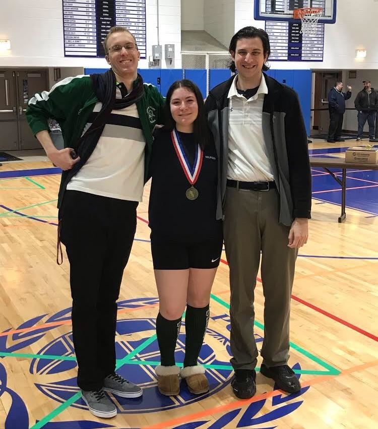 Christie Ack with her fencing coaches; photo credit: Yearbook 